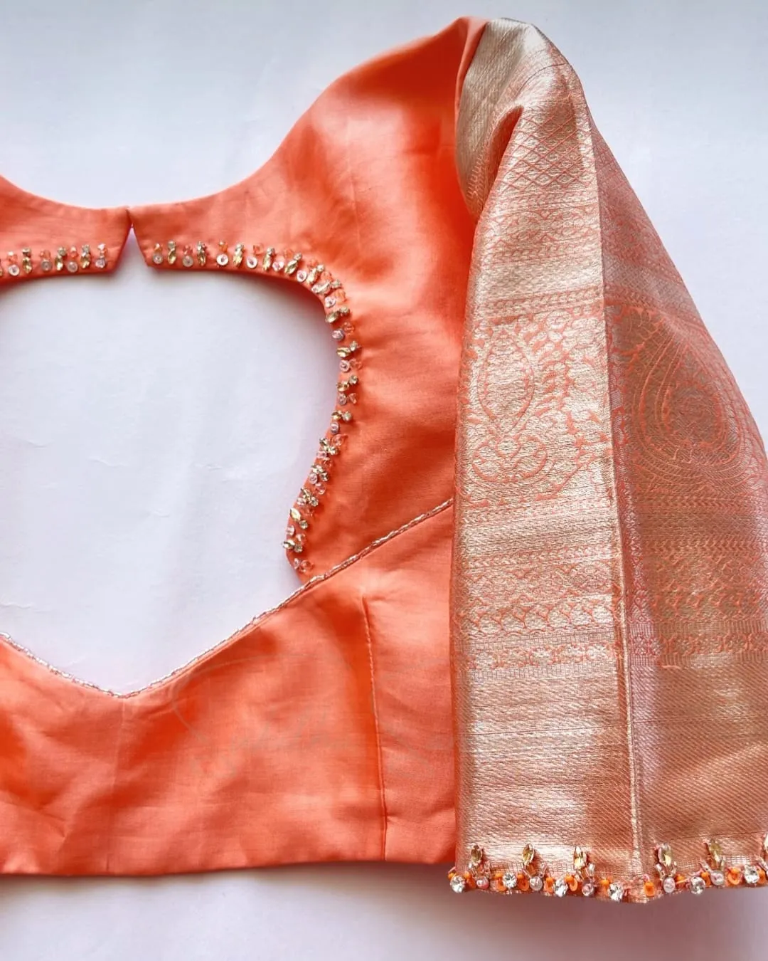 Elegant Glow – Orange Minimal Aari Work Blouse for Chic Occasions