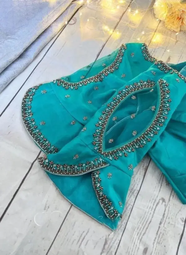 Divine Threads: Sky Blue Net Maggam Blouse with Scalloped Sleeve Detailing