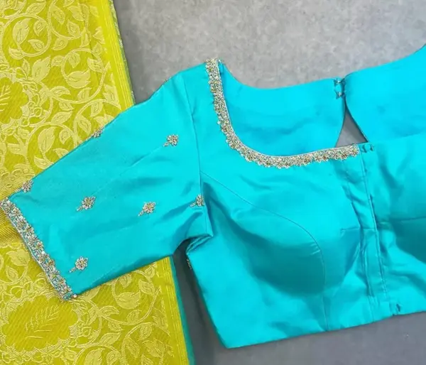 Elegant Sky Blue Net Aariwork Blouse with Designer Neckline – Trending Bridal Pick