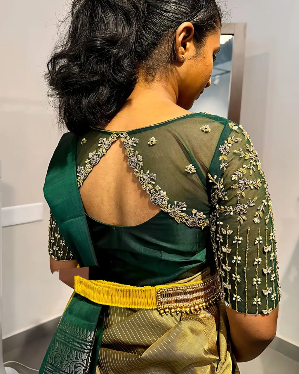 Enchanting Elegance: Bottle Green Wedding Blouse with Silver Maggam Detailing