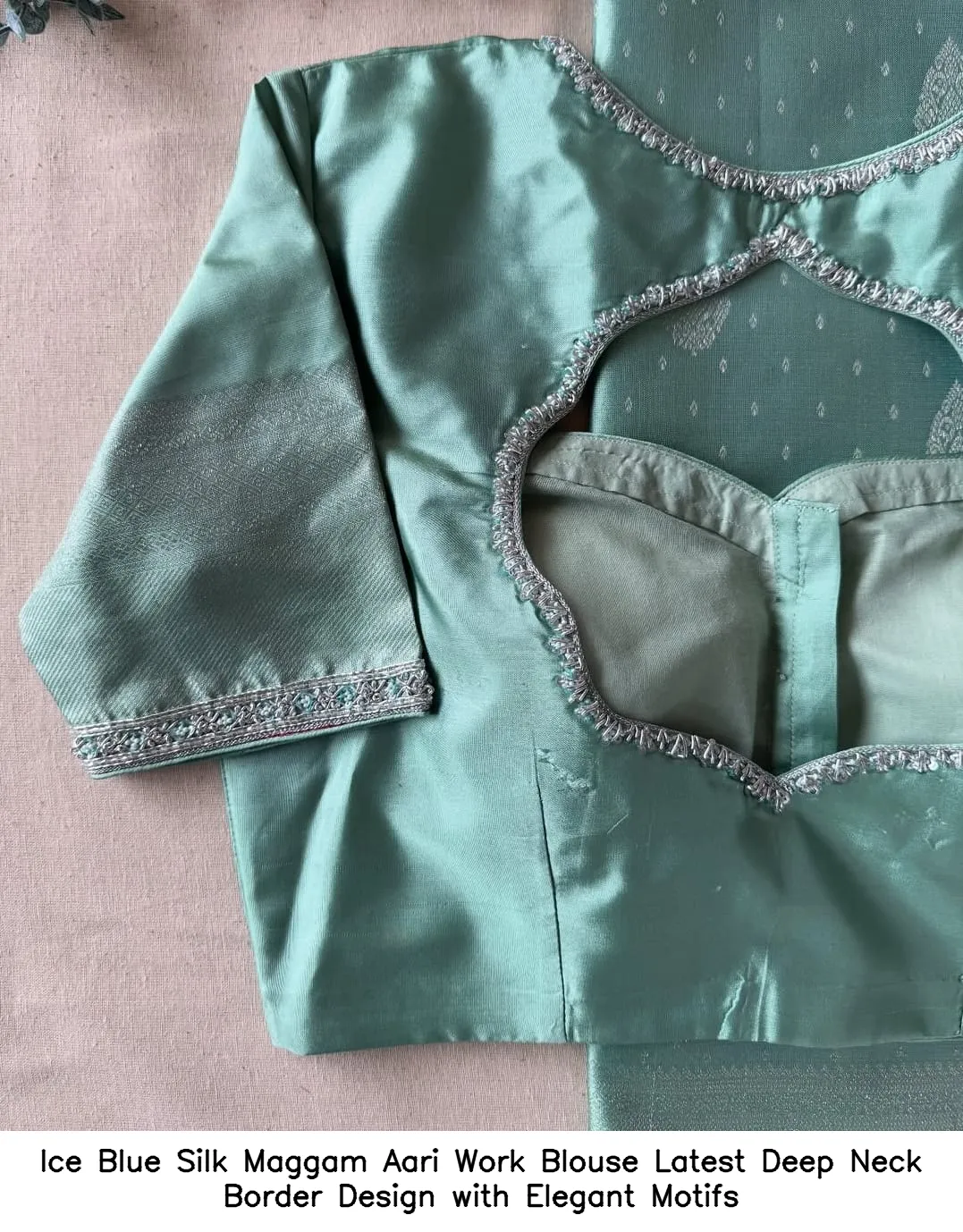 Ice Blue Silk Maggam Aari Work Blouse – Latest Deep Neck Border Design with Elegant Motifs