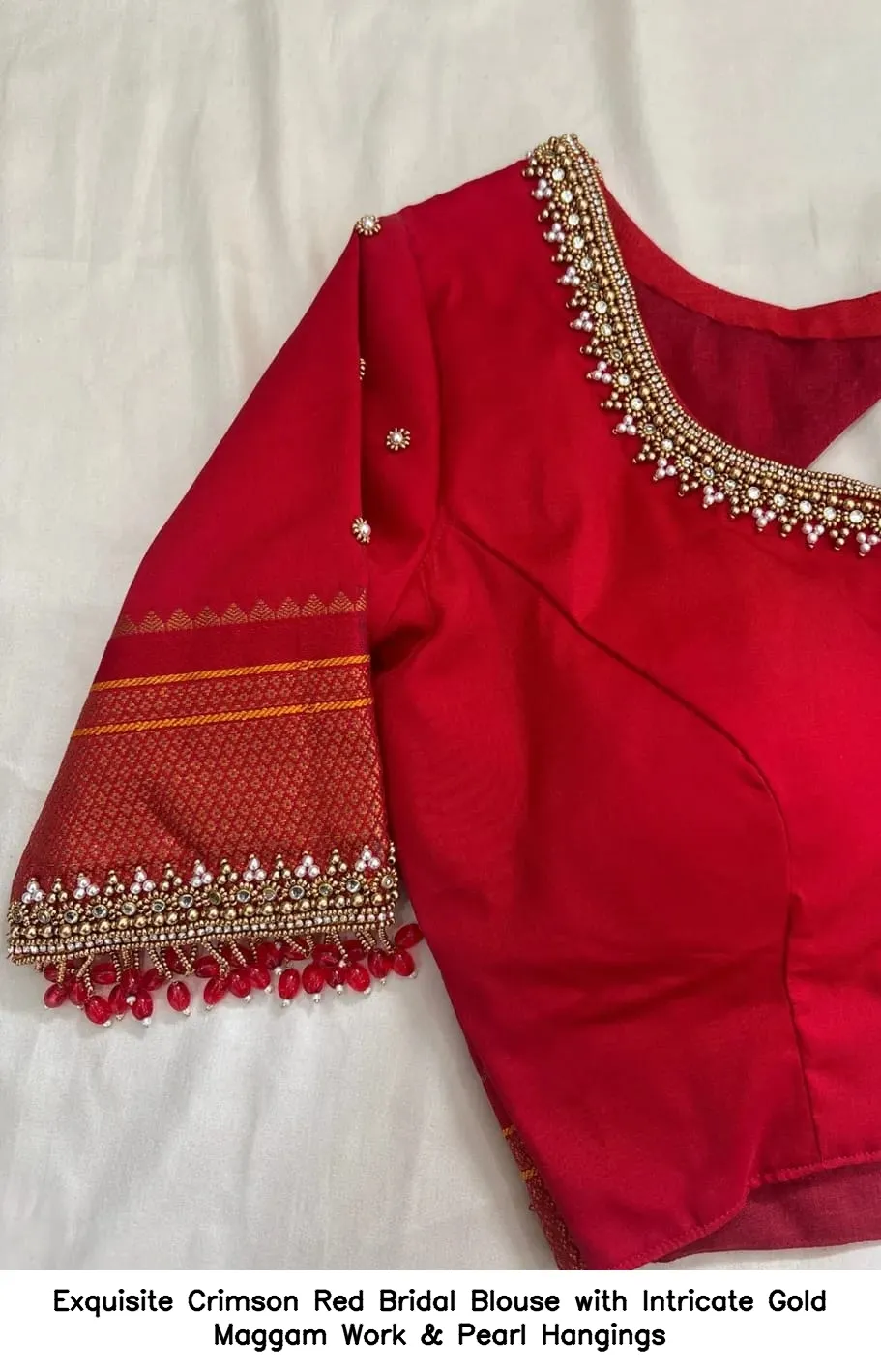 Exquisite Crimson Red Bridal Blouse with Intricate Gold Maggam Work & Pearl Hangings