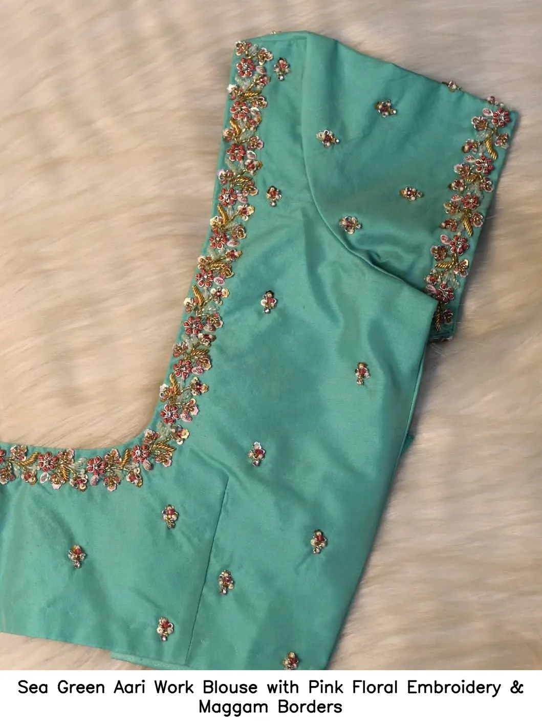 Sea Green Aari Work Blouse with Pink Floral Embroidery & Maggam Borders