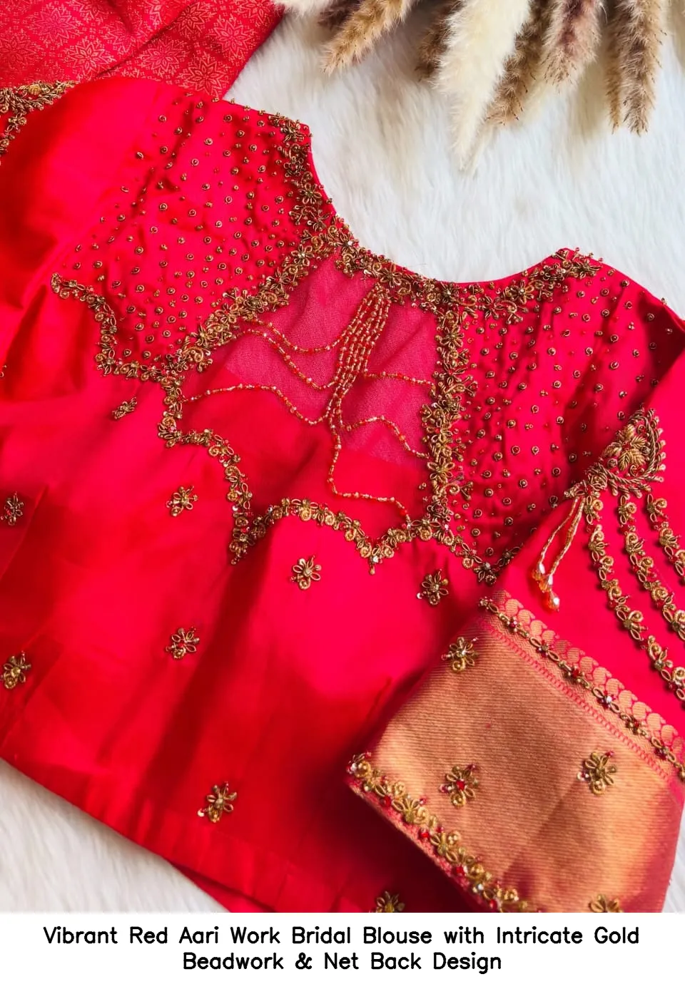 Vibrant Red Aari Work Bridal Blouse with Intricate Gold Beadwork & Net Back Design