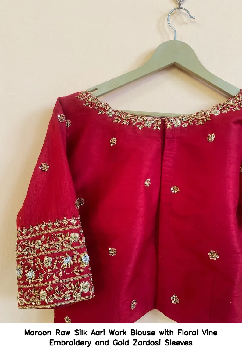 Maroon Raw Silk Aari Work Blouse with Floral Vine Embroidery and Gold Zardosi Sleeves
