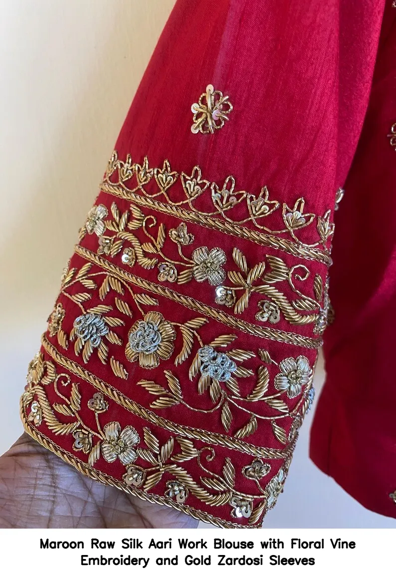 Maroon Raw Silk Aari Work Blouse with Floral Vine Embroidery and Gold Zardosi Sleeves