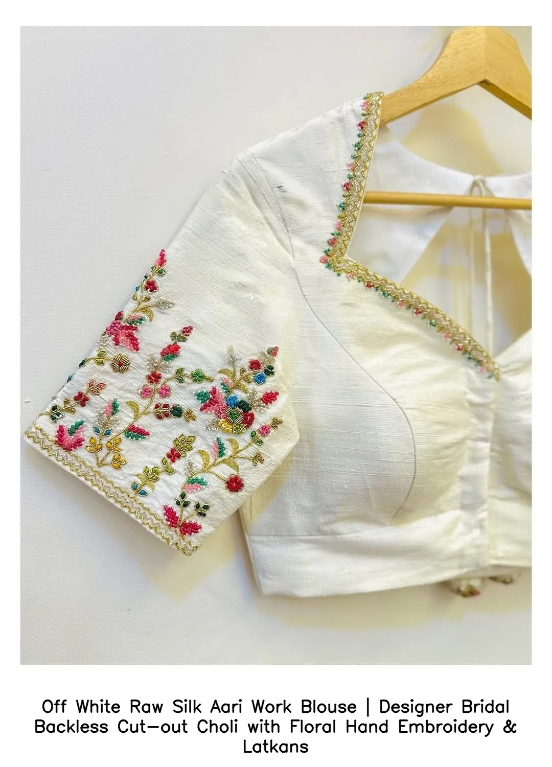 Off White Raw Silk Aari Work Blouse | Designer Bridal Backless Cut-out Choli with Floral Hand Embroidery & Latkans