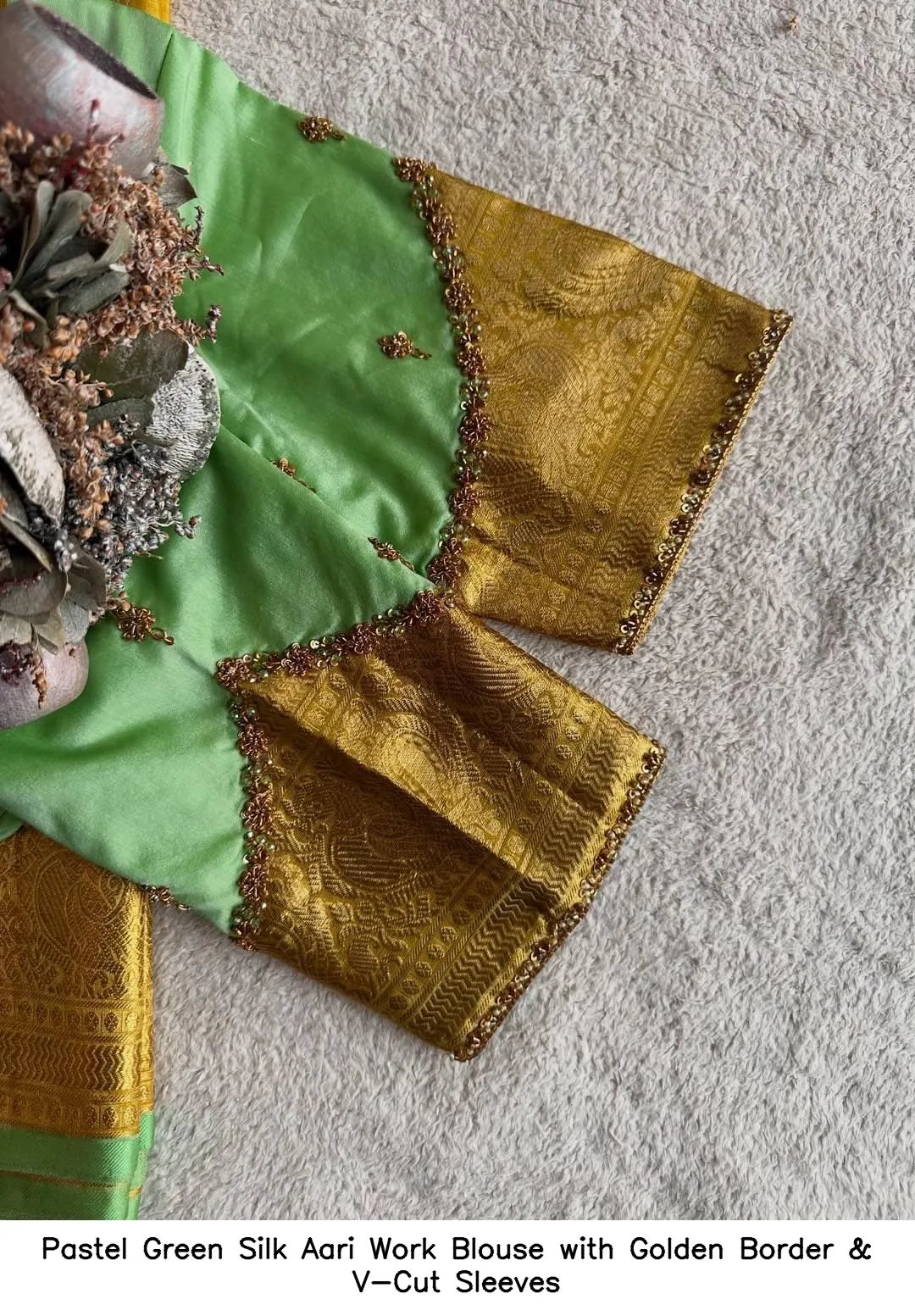 Pastel Green Silk Aari Work Blouse with Golden Border & V-Cut Sleeves