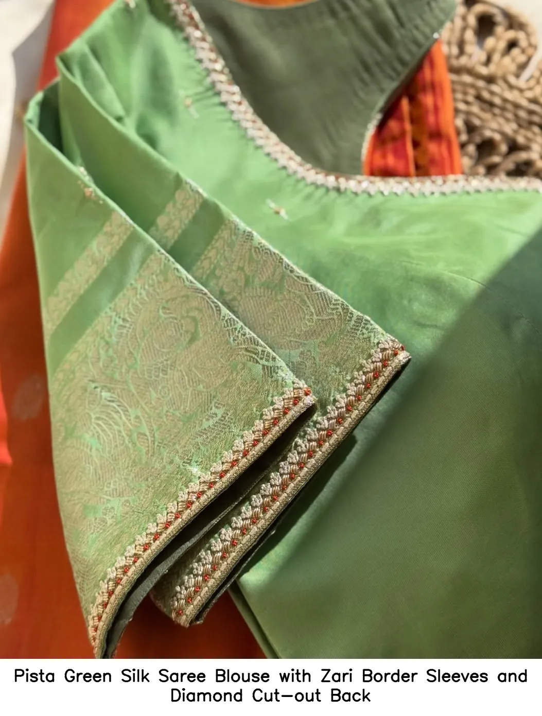 Pista Green Silk Saree Blouse with Zari Border Sleeves and Diamond Cut-out Back