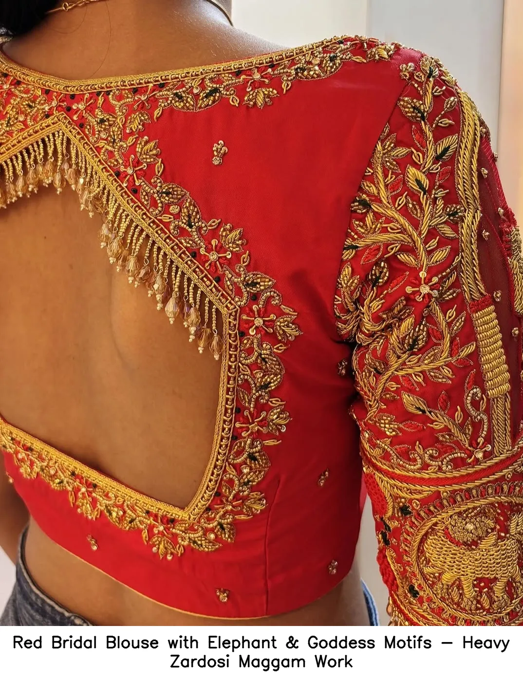 Red Bridal Blouse with Elephant & Goddess Motifs - Heavy Zardosi Maggam Work