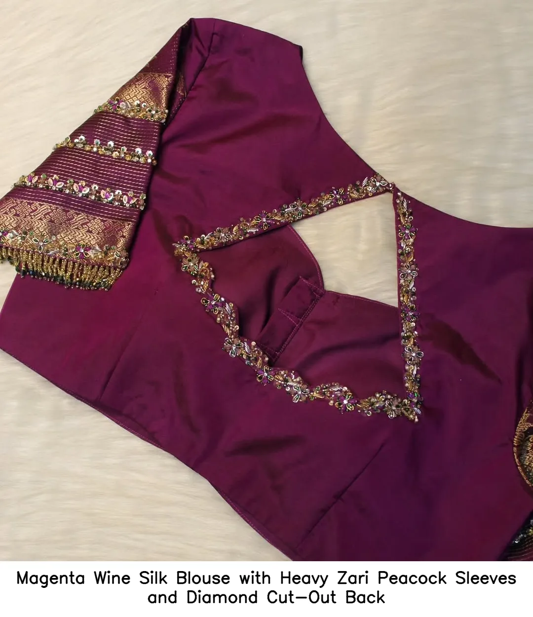 ​​​​Magenta Wine Silk Blouse with Heavy Zari Peacock Sleeves and Diamond Cut-Out Back
