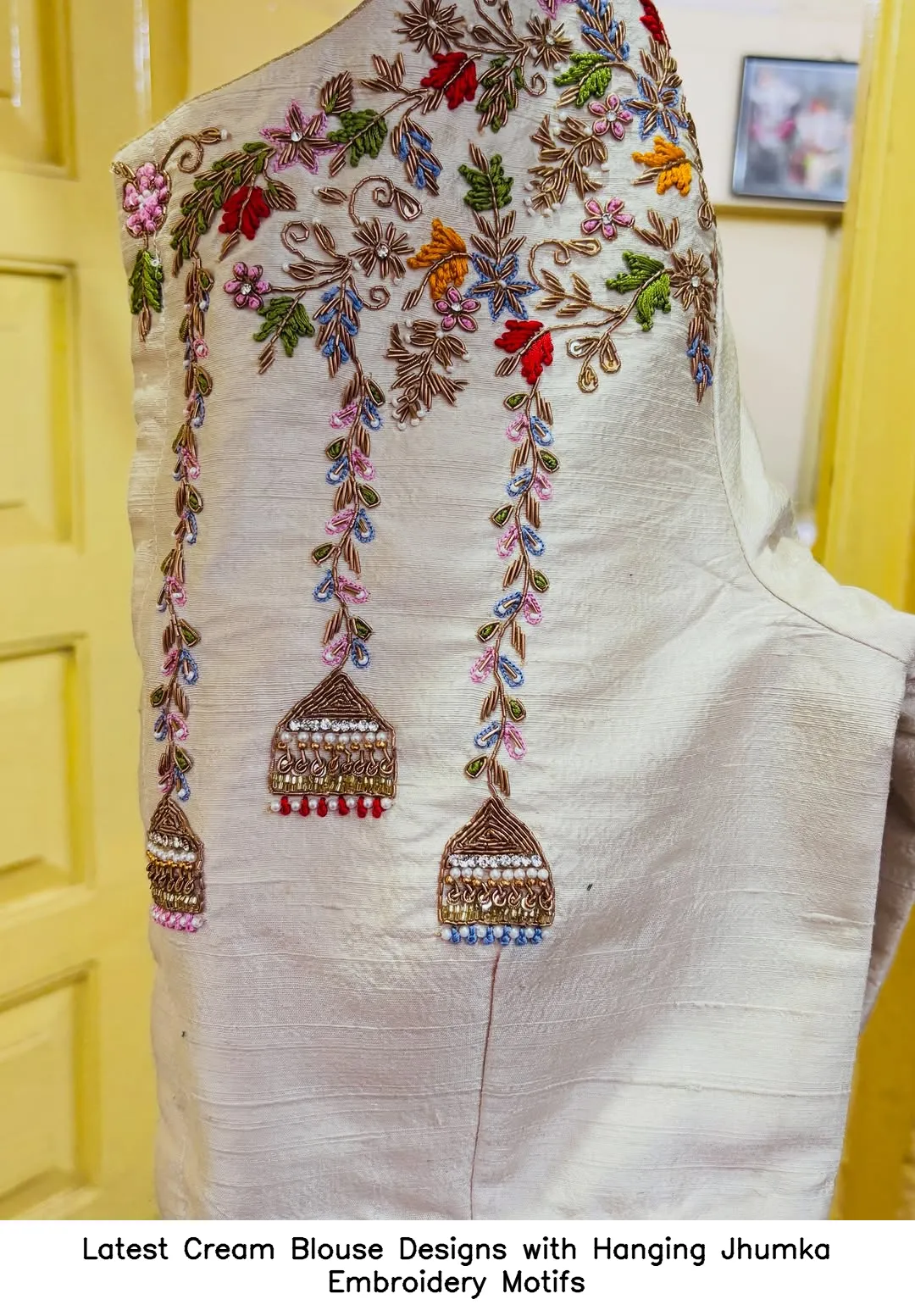 Latest Cream Blouse Designs with Hanging Jhumka Embroidery Motifs