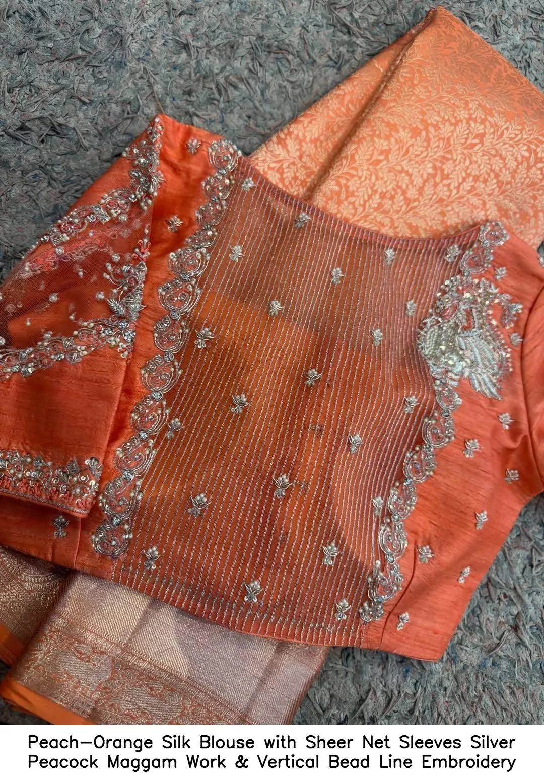 Peach-Orange Silk Blouse with Sheer Net Sleeves – Silver Peacock Maggam Work & Vertical Bead Line Embroidery
