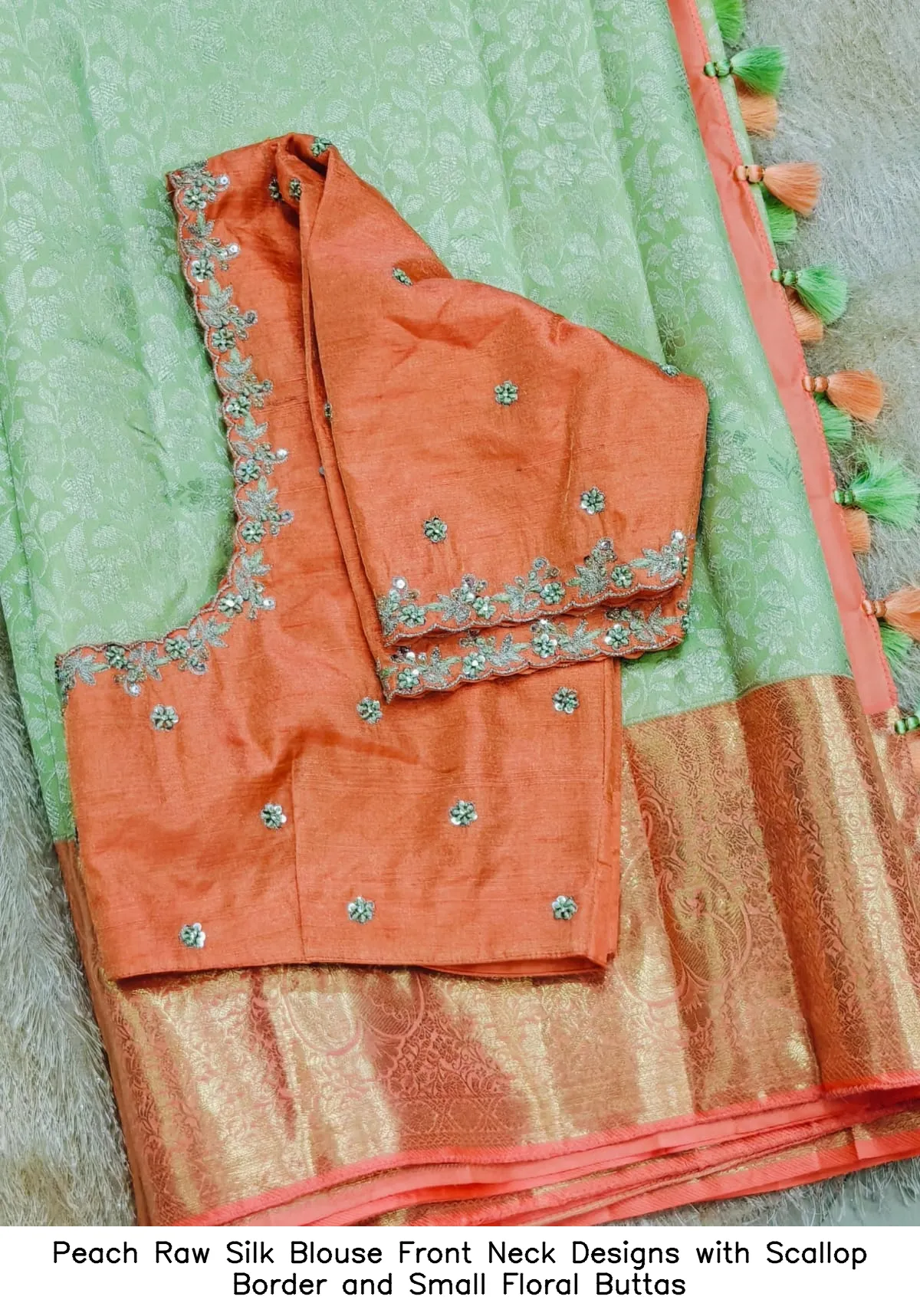 Peach Raw Silk Blouse Front Neck Designs with Scallop Border and Small Floral Buttas