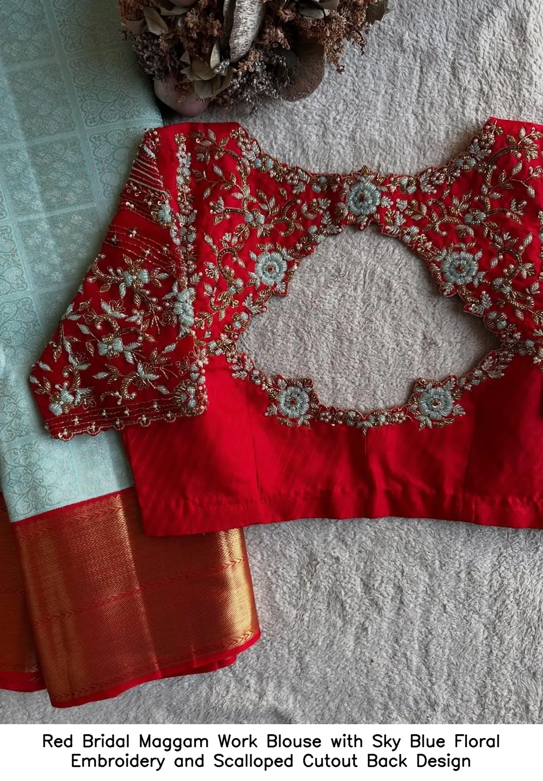 Red Bridal Maggam Work Blouse with Sky Blue Floral Embroidery and Scalloped Cutout Back Design