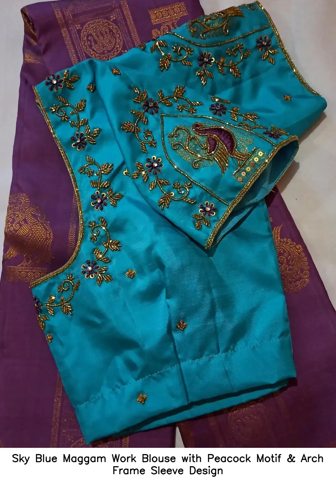 Sky Blue Maggam Work Blouse with Peacock Motif & Arch Frame Sleeve Design