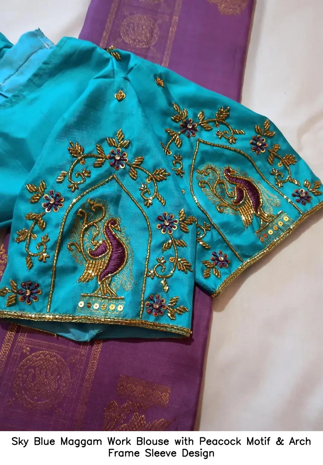 Sky Blue Maggam Work Blouse with Peacock Motif & Arch Frame Sleeve Design