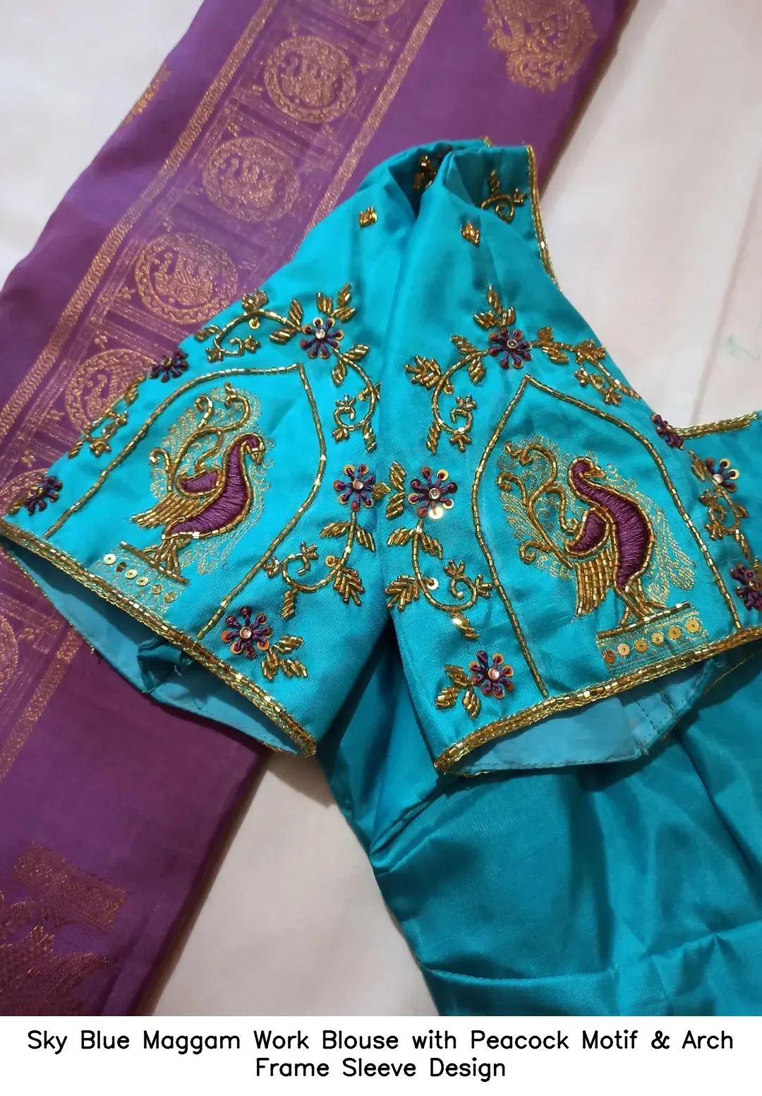 Sky Blue Maggam Work Blouse with Peacock Motif & Arch Frame Sleeve Design