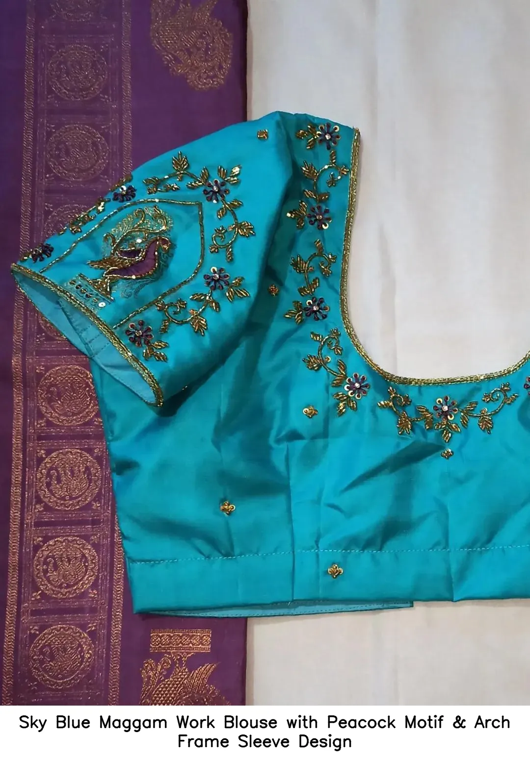 Sky Blue Maggam Work Blouse with Peacock Motif & Arch Frame Sleeve Design