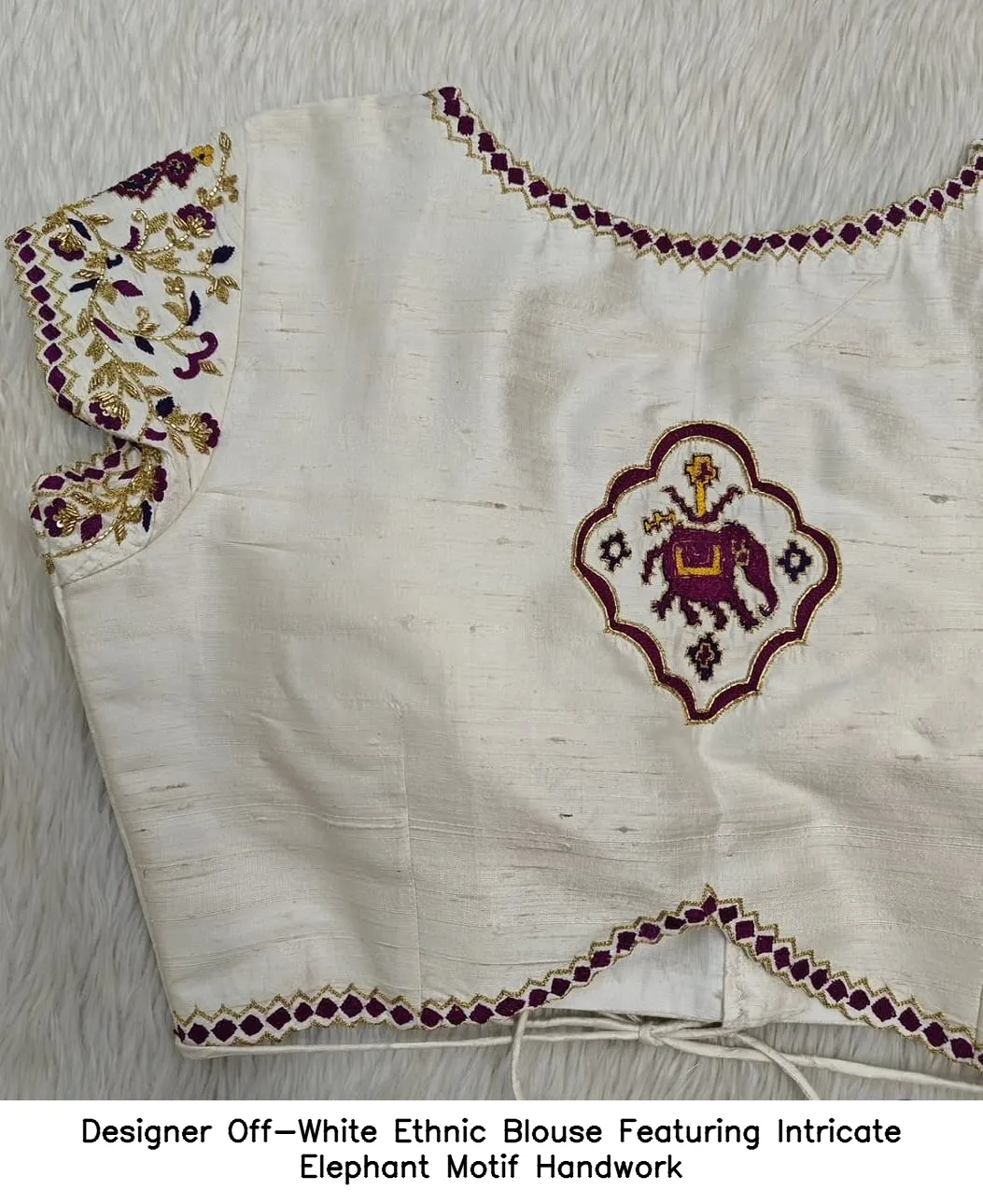 Designer Off-White Ethnic Blouse Featuring Intricate Elephant Motif Handwork