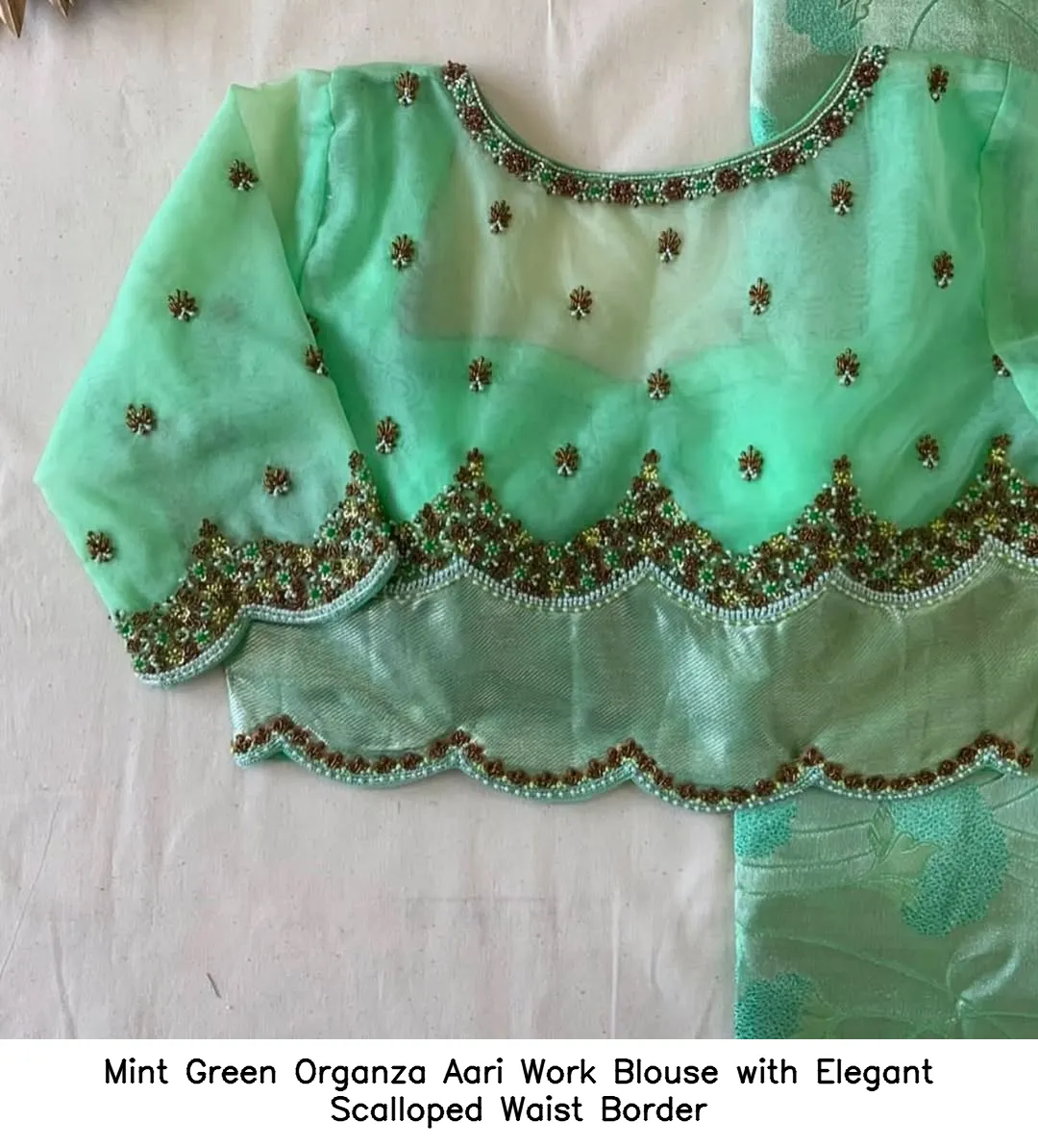 Mint Green Organza Aari Work Blouse with Elegant Scalloped Waist Border