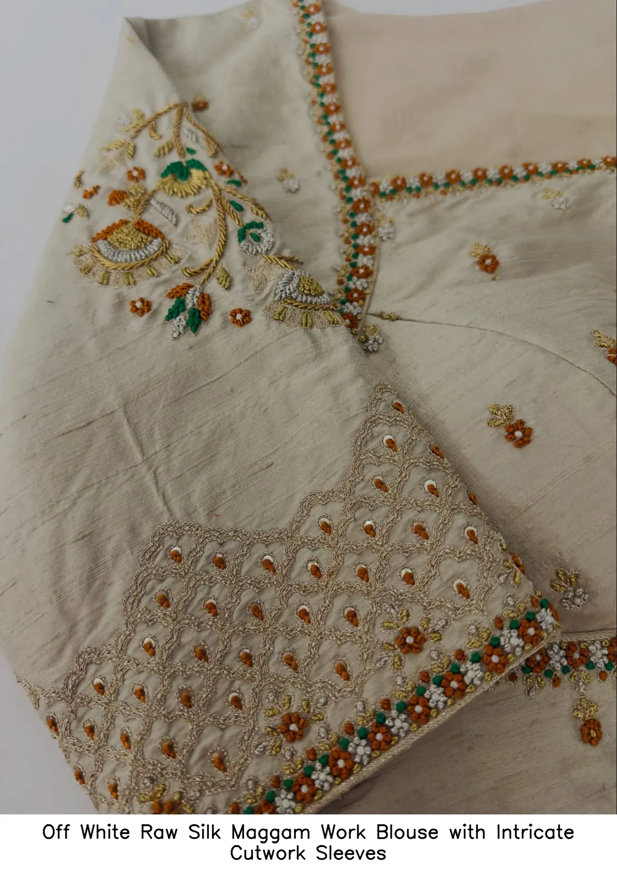 Off White Raw Silk Maggam Work Blouse with Intricate Cutwork Sleeves