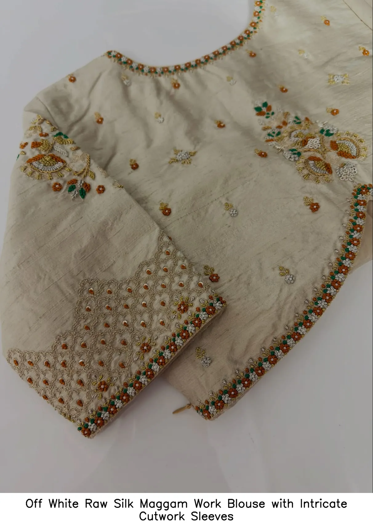 Off White Raw Silk Maggam Work Blouse with Intricate Cutwork Sleeves