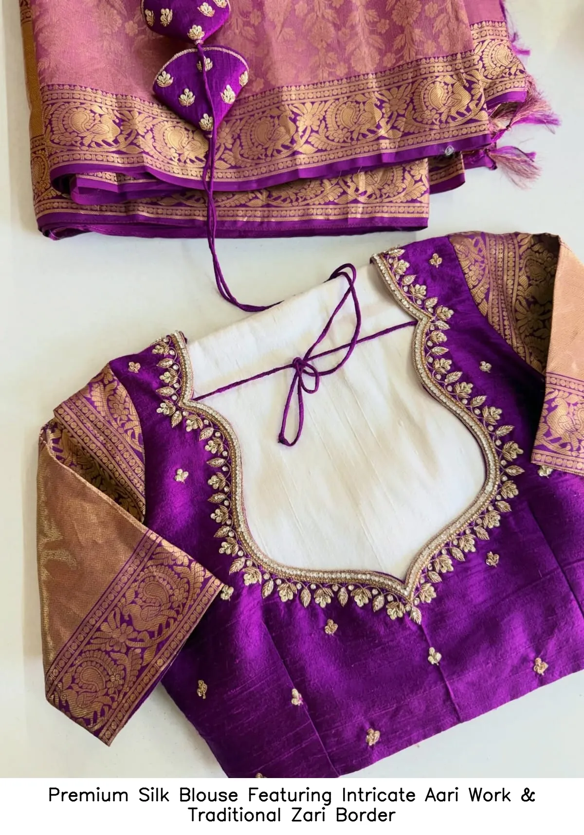 Premium Silk Blouse Featuring Intricate Aari Work & Traditional Zari Border