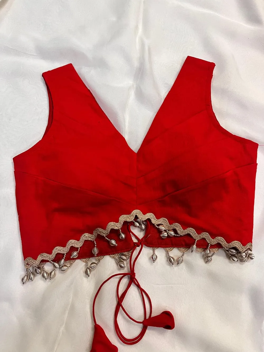 Red Sleeveless Designer Blouse with Scalloped Hem and Latkan |