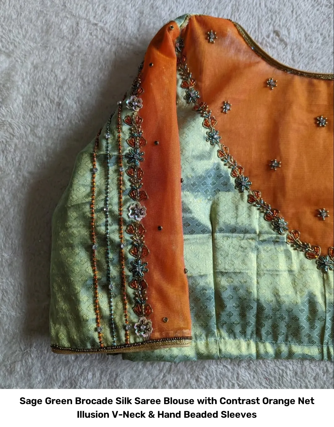 Sage Green Brocade Silk Saree Blouse with Contrast Orange Net Illusion V-Neck & Hand Beaded Sleeves 2