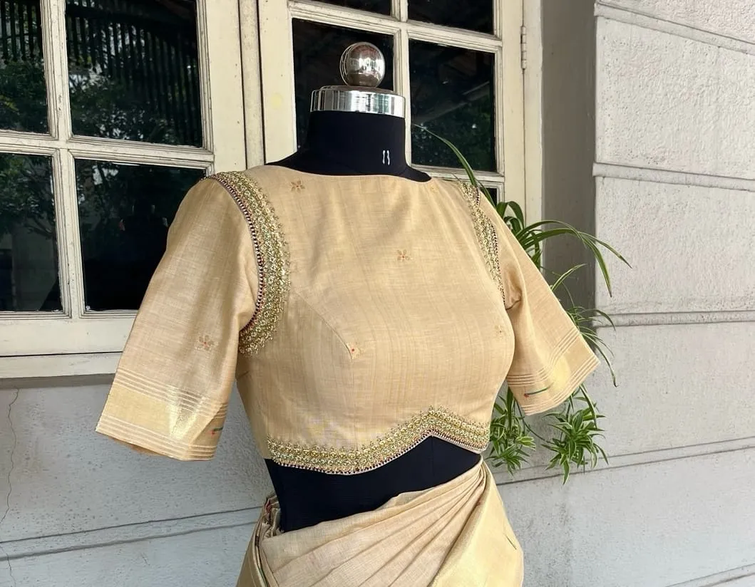 Beige Raw Silk Saree with Boat Neck Designer Blouse | V-Hem Zardozi Border & Cutout Back Set
