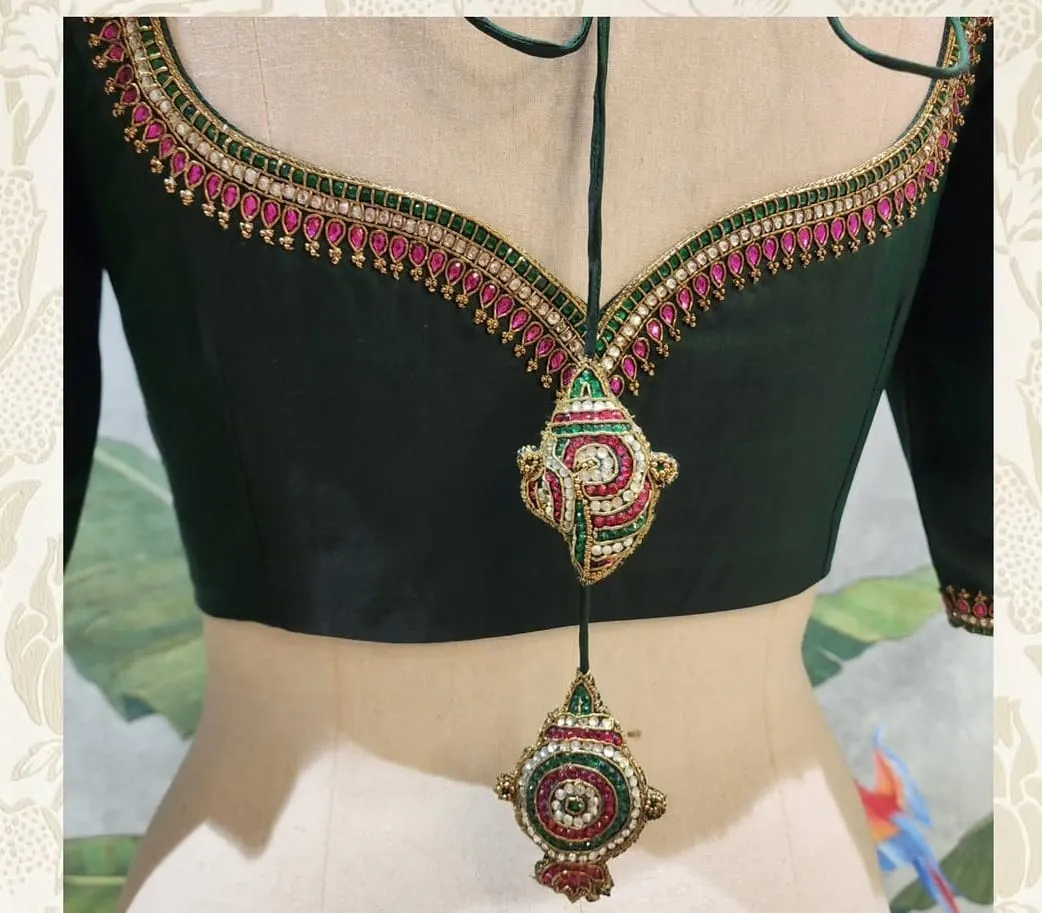 Bottle Green Raw Silk Maggam Work Blouse with Kemp Jhumka Sleeves & Shankh Latkan