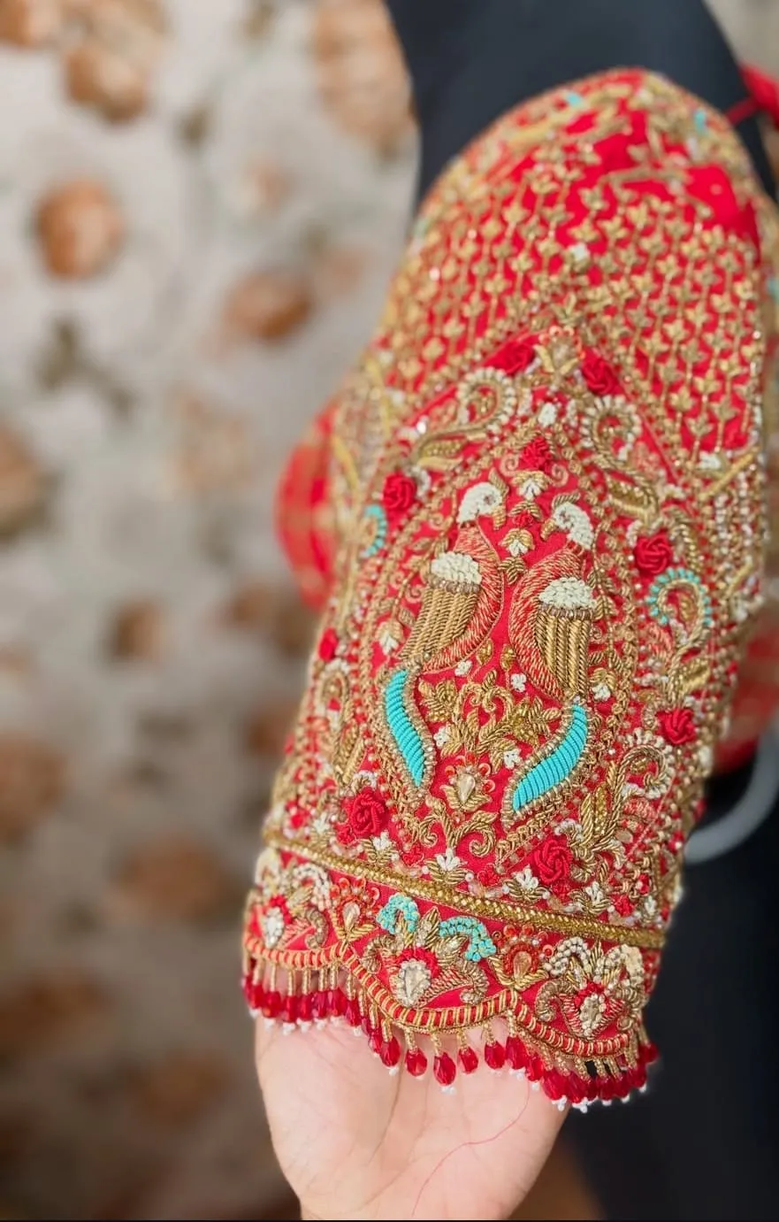 Bridal Red Raw Silk Maggam Work Blouse – Heavy Peacock Zardozi Sleeves with Deep Scallop Back Neck & Beaded Latkan