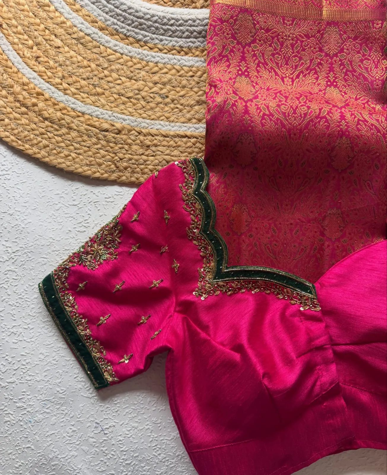 Magenta Pink Designer Bridal Blouse featuring Green Velvet Accents, Zari Floral Buttis & Hand-Embroidered Maggam Work | Padded Blouse