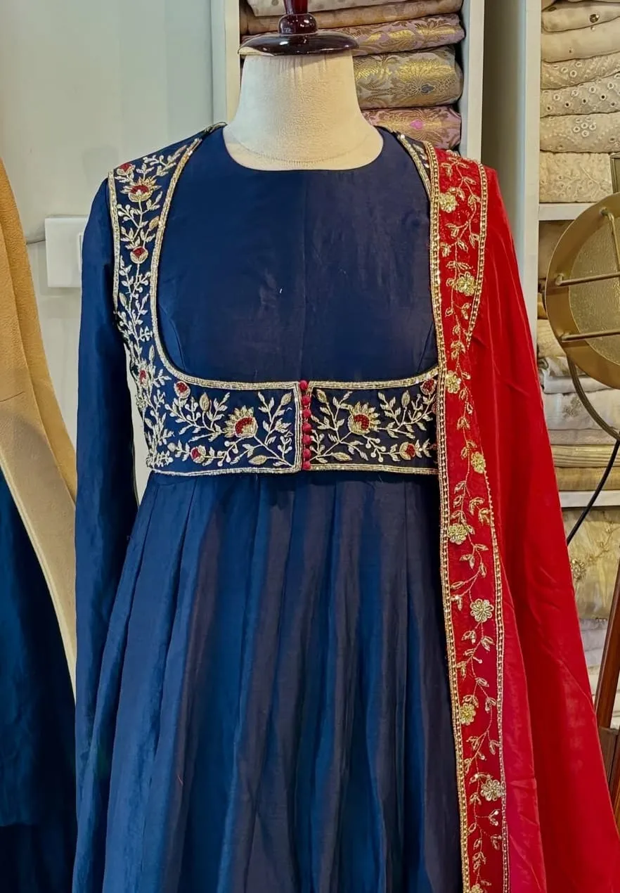 Navy Blue Raw Silk Anarkali Suit with Embroidered Crop Jacket – Flared Festive Gown Set with Contrast Red Zari Dupatta