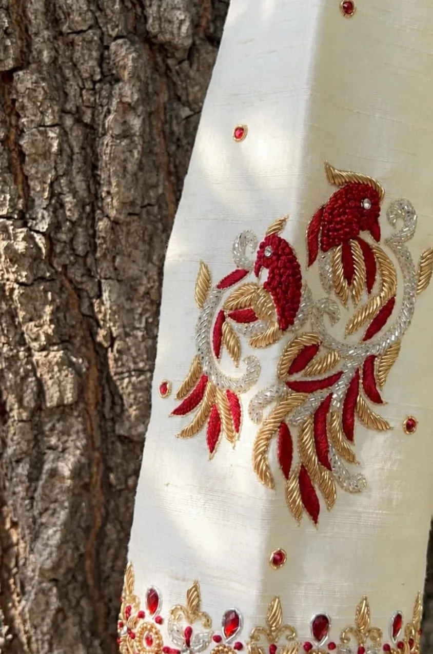Off-White Raw Silk Maggam Work Blouse with Asymmetric Neck & Red Zardosi Twin Birds