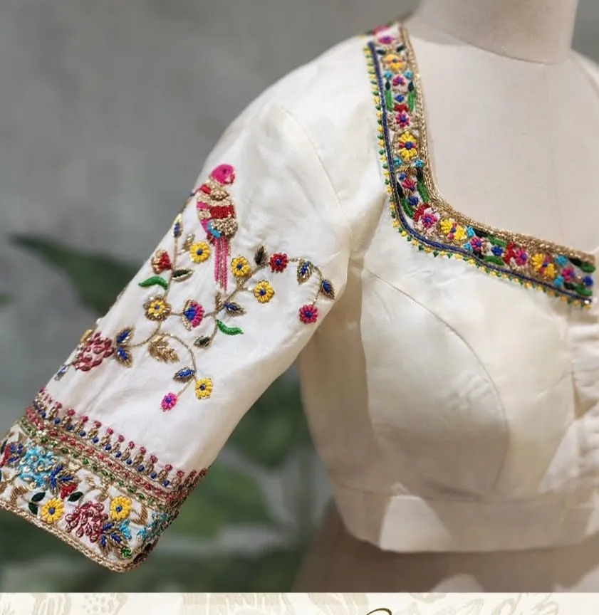 Off-White Raw Silk Maggam Work Blouse with Multicolor Thread Parrot Motifs & Back Buttons