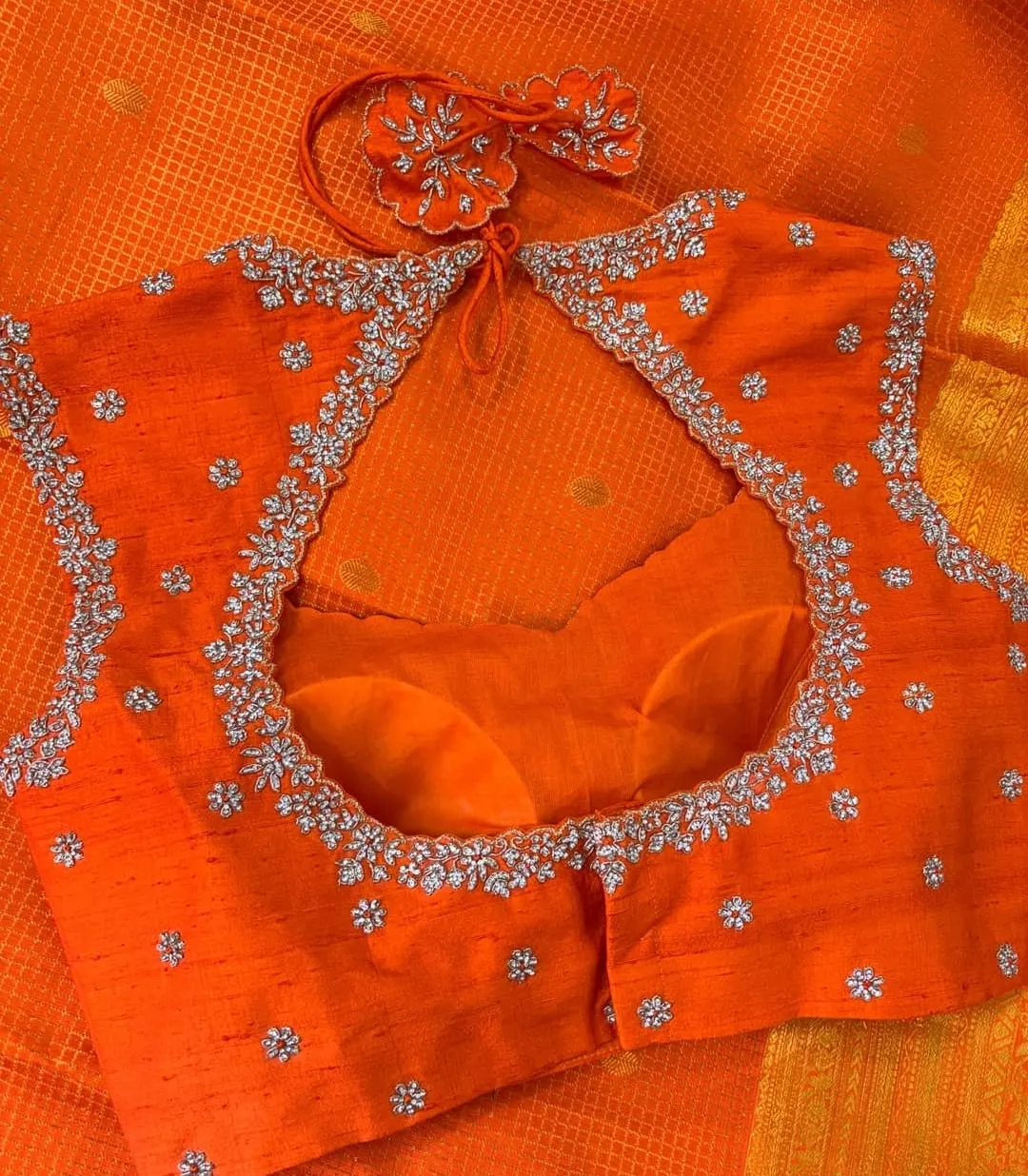 Orange Raw Silk Sleeveless Blouse with Silver Zardozi Border & Cutout Back