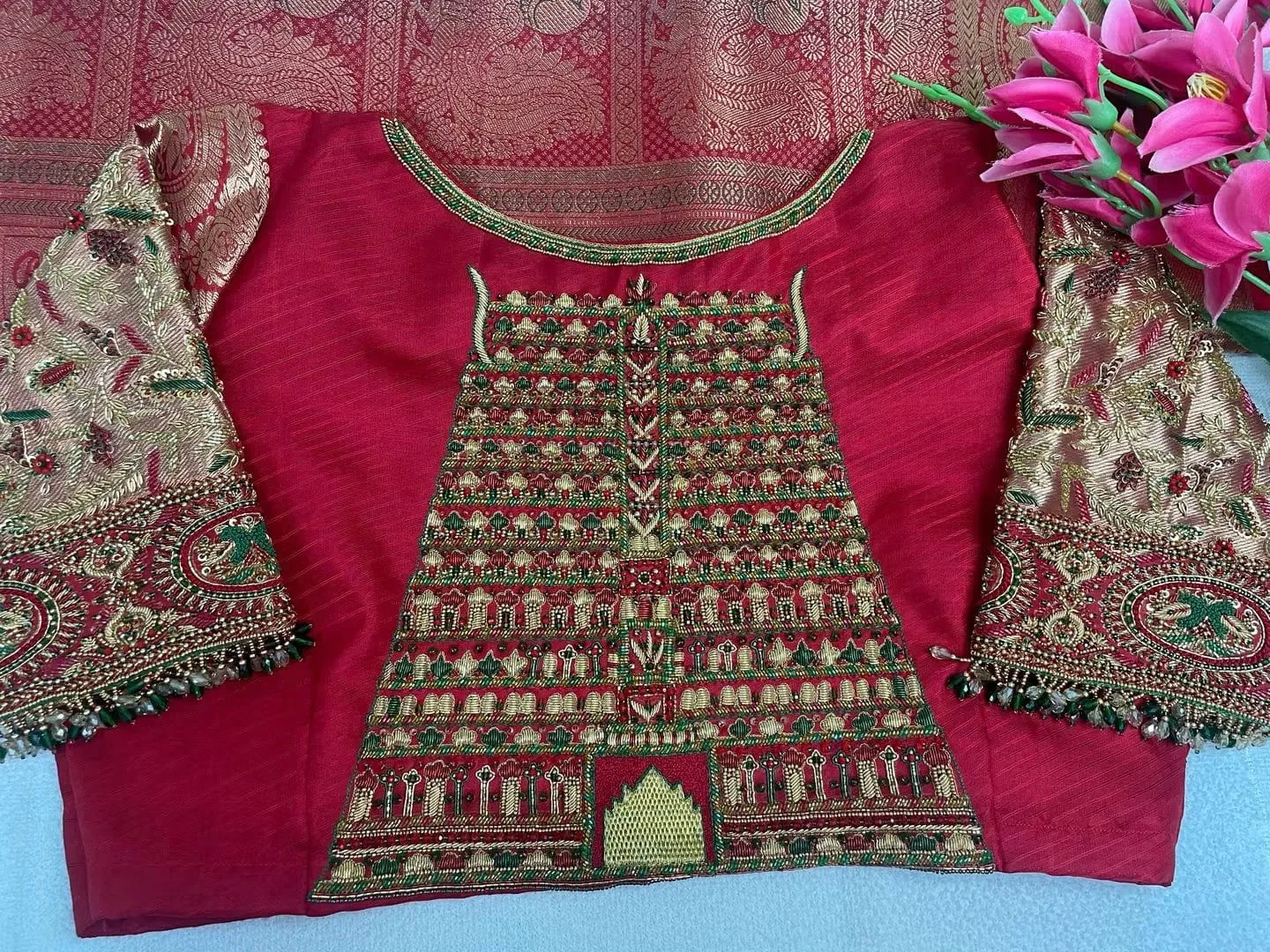 Red Silk Bridal Blouse with Temple Gopuram Maggam Work – Handcrafted Aari Embroidery & Rich Zari Sleeves with Bead Drops 1