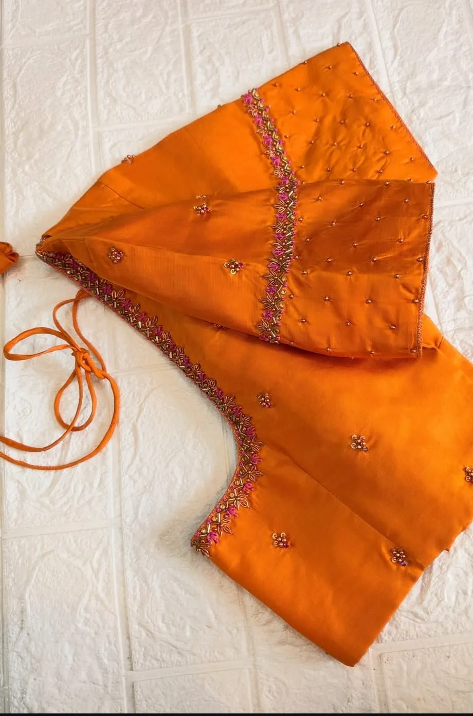 Bright Orange Raw Silk Saree Blouse with Handcrafted Pink Aari Work Border