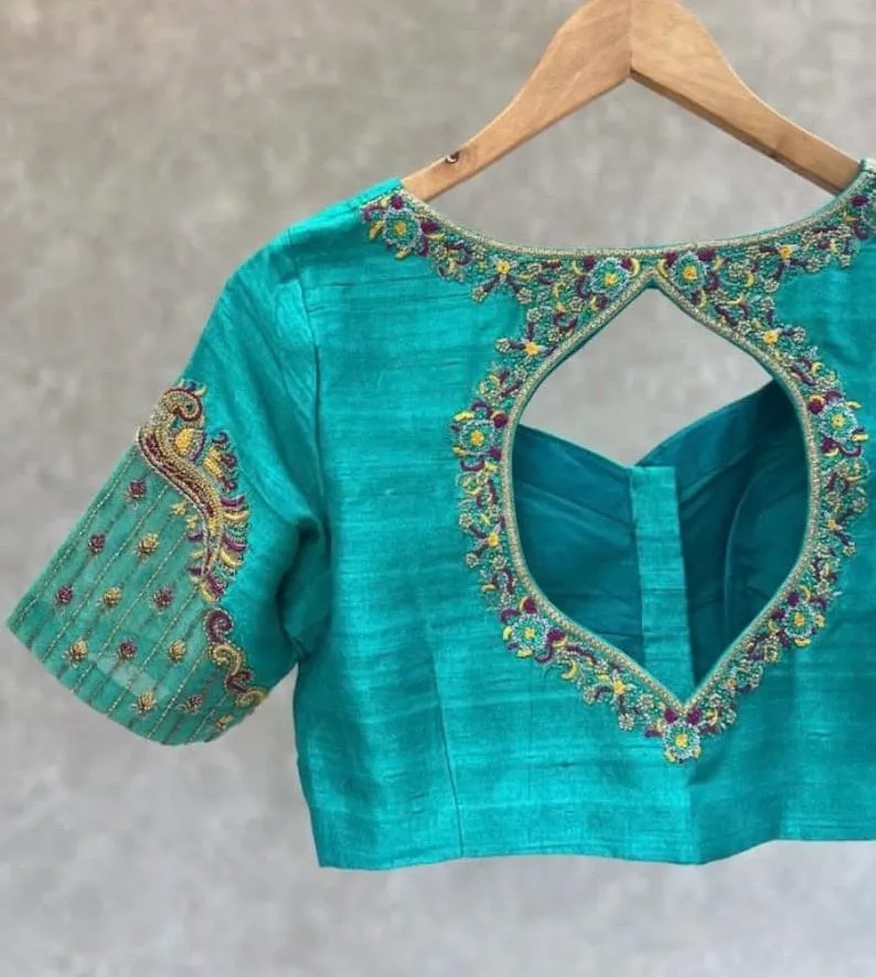 Teal Green Raw Silk Maggam Work Blouse | Multicolor Thread Floral Cutout Back & Peacock Motif Saree Blouse